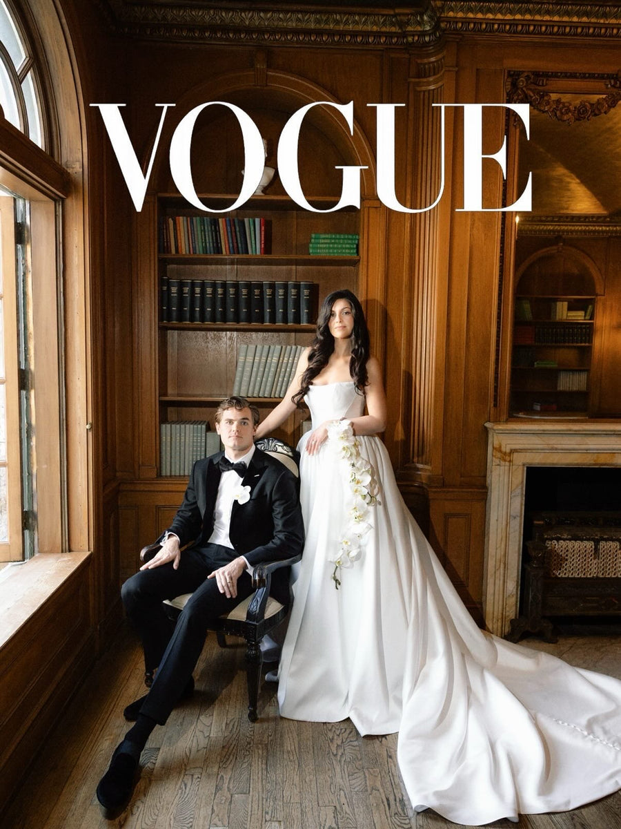 Sara & husband featured in Vogue — ball gown with cascading orchids in wood-paneled library